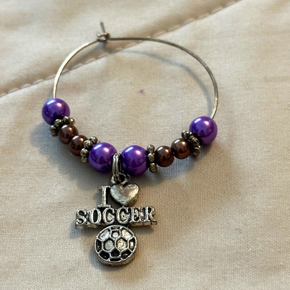 Wine glass tag – stainless steel hoop, purple/mocha beads, soccer charm